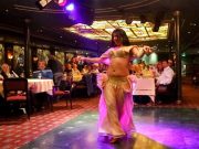 Elegant Nile dinner cruise with illuminated Cairo skyline at night.